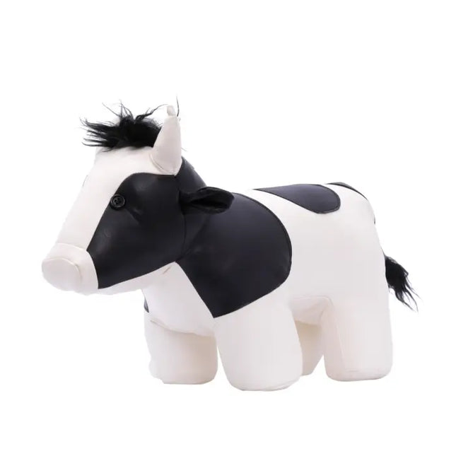 Black and white cow door stop figurine on white background